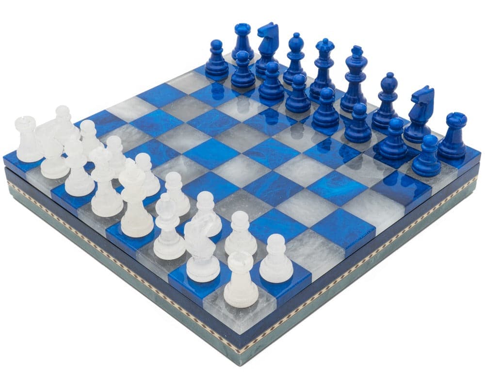 Elegant blue and white marble chess set with pieces neatly arranged on a checkered board.