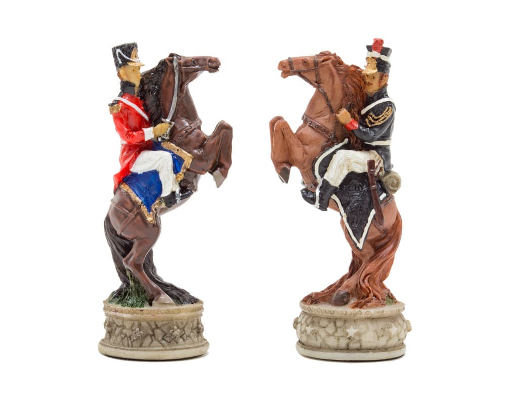 Hand-painted Battle of Waterloo chess pieces depicting red and blue uniformed soldiers on rearing horses by Italfama.