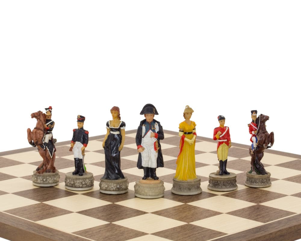 Hand painted Battle of Waterloo chess pieces by Italfama on a chessboard, featuring Napoleon Bonaparte and Wellington in ornate detail