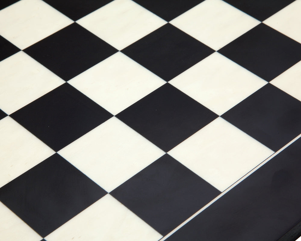 Close-up of 21.7 inch matt black and maple deluxe chess board with 2.17 inch playing squares, crafted in Spain.