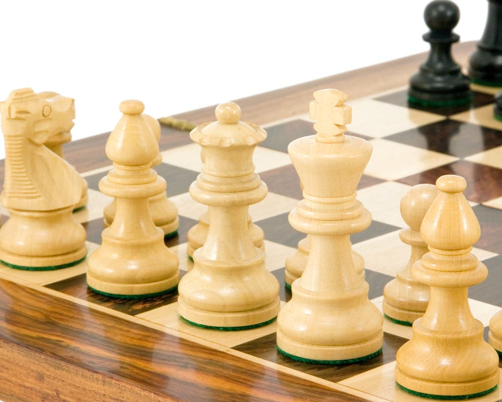 French Knight Series Ebonised Staunton Chess Pieces 3.25 Inches on wooden chessboard, featuring expertly turned boxwood chessmen