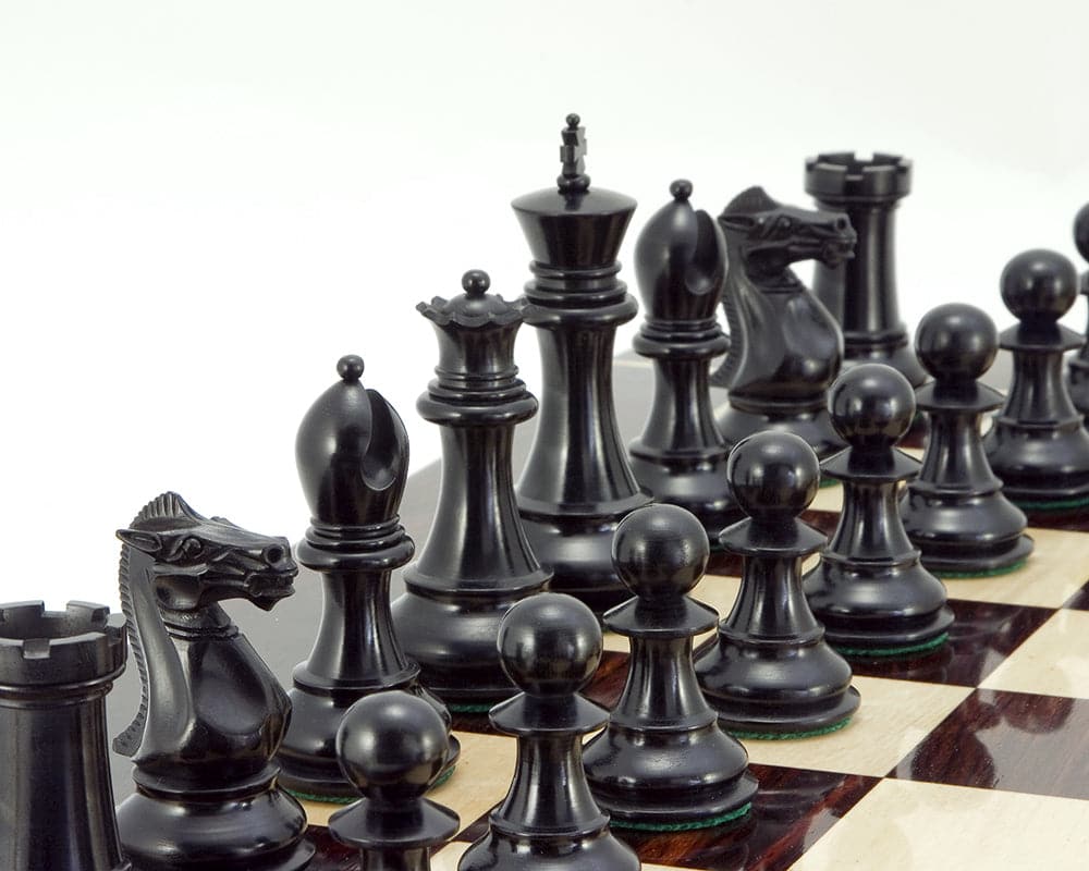 Sandringham Series Ebony Staunton Chess Pieces crafted from anjan wood, showing 4-inch king and weighted, felted pieces on a chessboard.