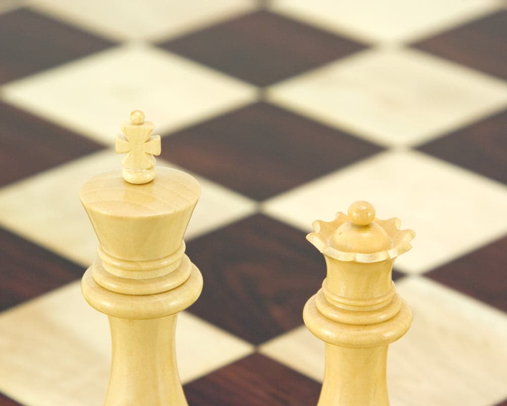 Sandringham Series Ebony Staunton chess pieces, an elegant king and queen on a checkered chessboard, crafted from anjan wood, 4 inches.