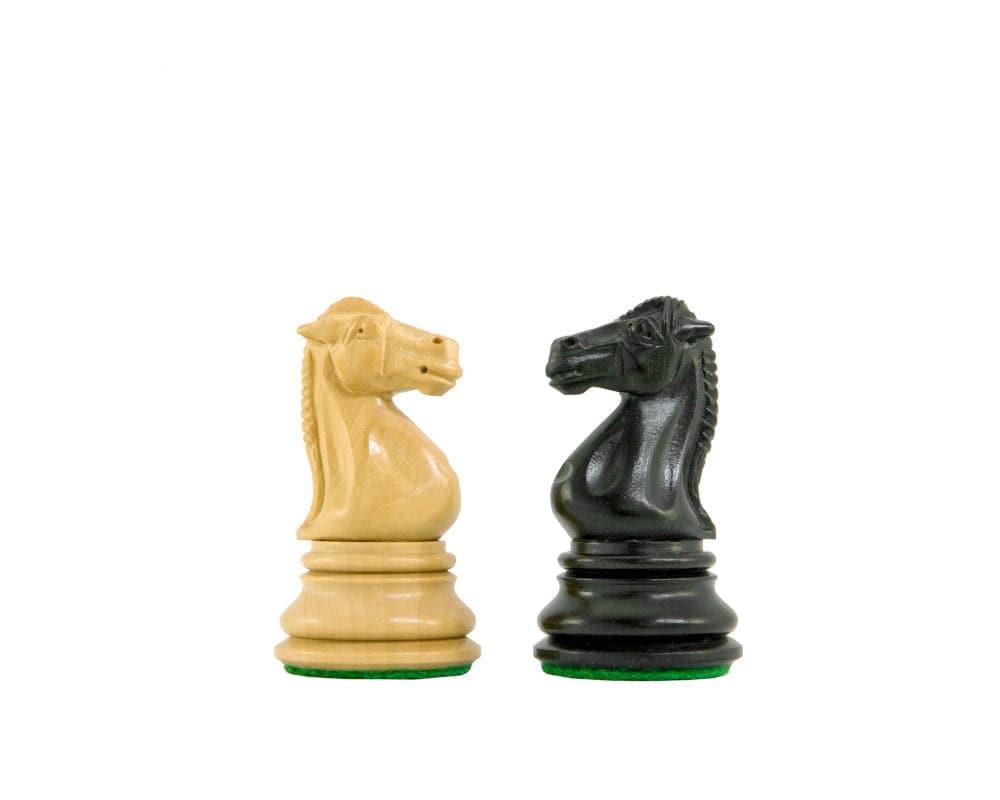 Handcrafted ebony and boxwood knight chess pieces from the Cheltenham Series, featuring intricate detailing and felted bases.