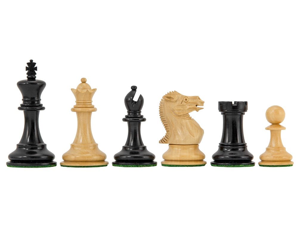 The Highgrove Series Ebony and Boxwood Staunton Chess Pieces, featuring a 3 inch king, detailed knight, and bishop, with broad bases.