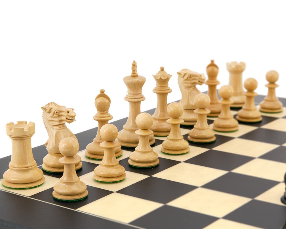 Highgrove Series Ebony and Boxwood Staunton Chess Pieces on a 20 inch chessboard.