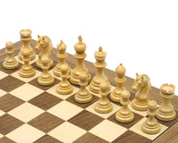 The Garvi Ebony Chessmen set with 4-inch king and Staunton design, showing Mughal influence on a chessboard.