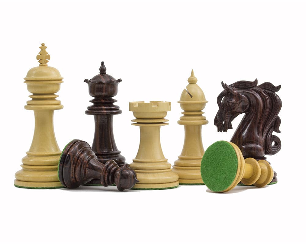 The Kingsgate Rosewood Chessmen in 4.25 inch size with ornate knights and billiard cloth bases.