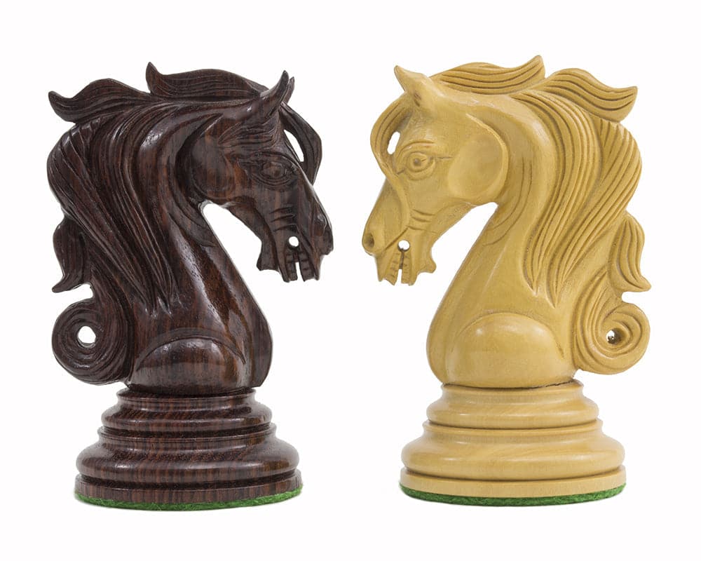 Ornate rosewood and boxwood knight chess pieces from Kingsgate Rosewood Chessmen Collection. Exquisite craftsmanship.