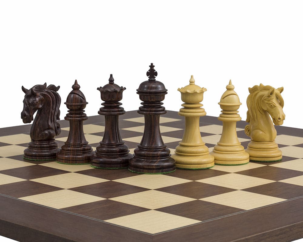 The Kingsgate Rosewood Chessmen 4.25 inch, handcrafted ornate pieces on chessboard, including detailed knights and additional queens, perfect balance