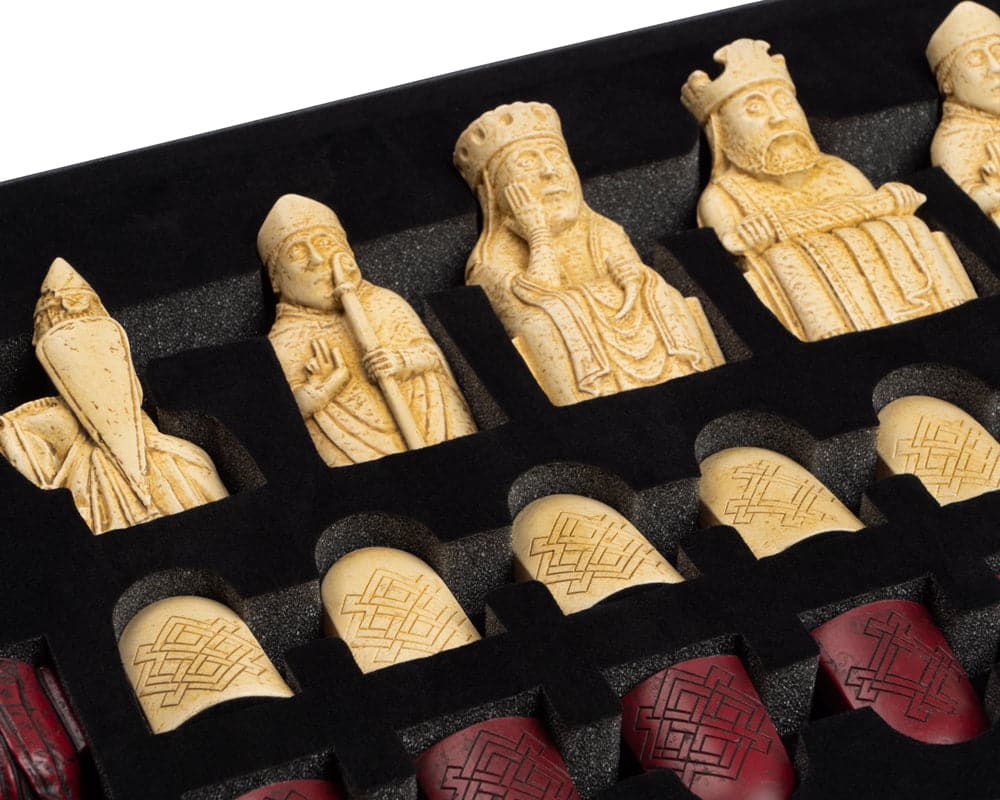 Isle of Lewis red and ivory chess pieces in black foam packaging from The Regency Chess Company