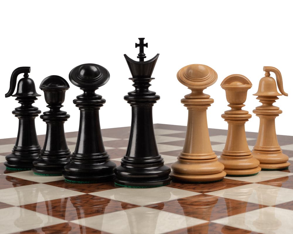 The Greek Staunton Ebony Series chess pieces on a 20-inch Mahogany and Birch chessboard with 2-inch playing squares.