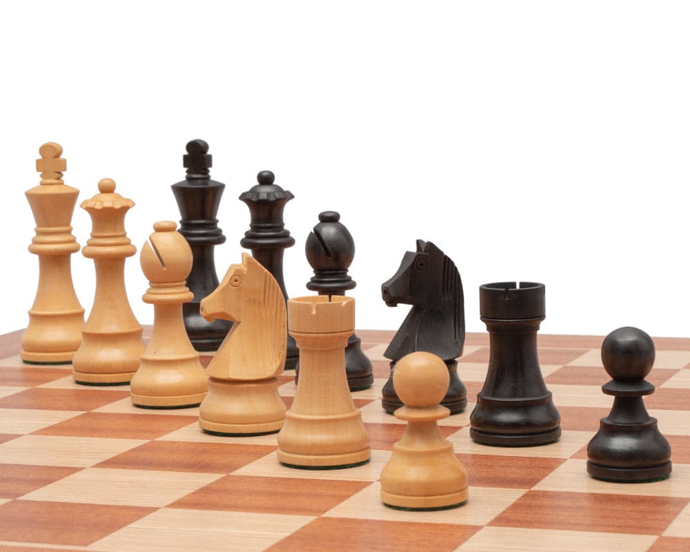 Ebonised and natural wooden chess pieces on a high-quality mahogany and birch chessboard from Greece.