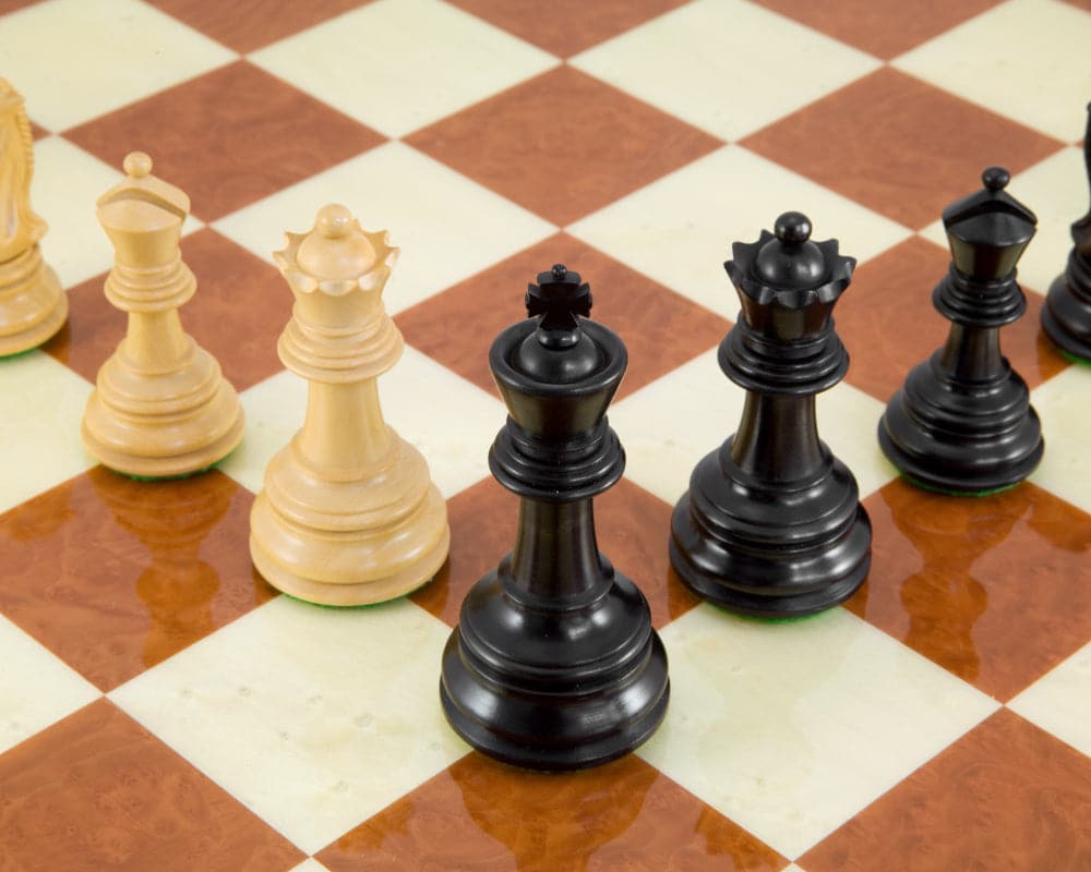 Handcrafted ebony and rootwood chess pieces on 24 inch Italian board