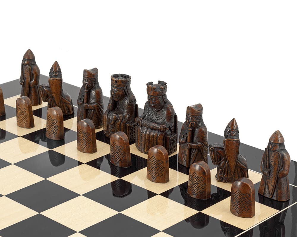 Isle of Lewis black gloss chess set featuring detailed pieces on a black anegre gloss chess board