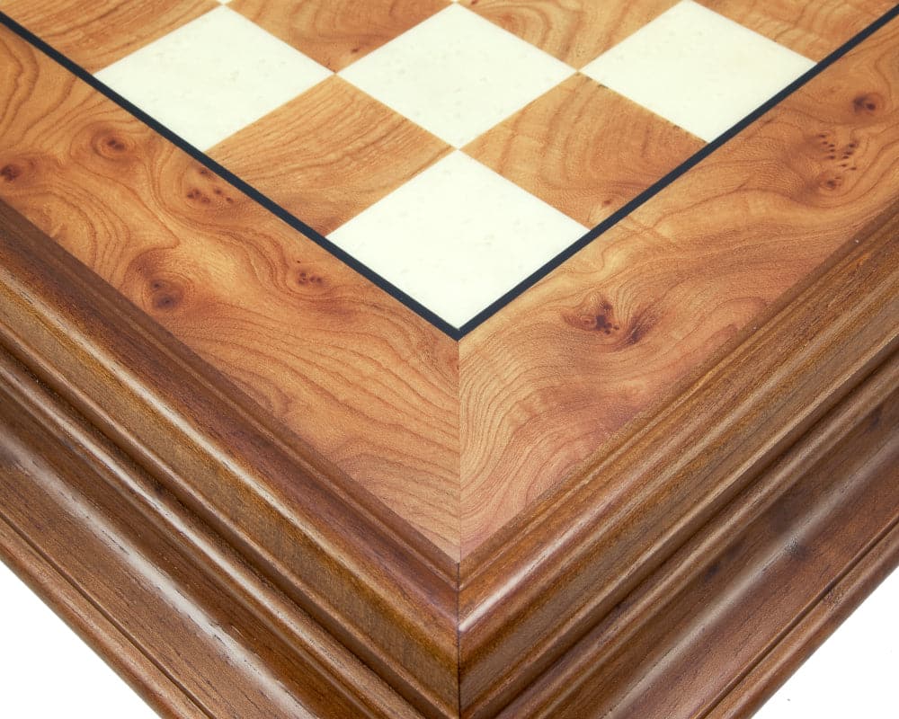 Close-up of Maghreb Brass and Briarwood Chess Cabinet corner with briarwood and maple finish detailing.