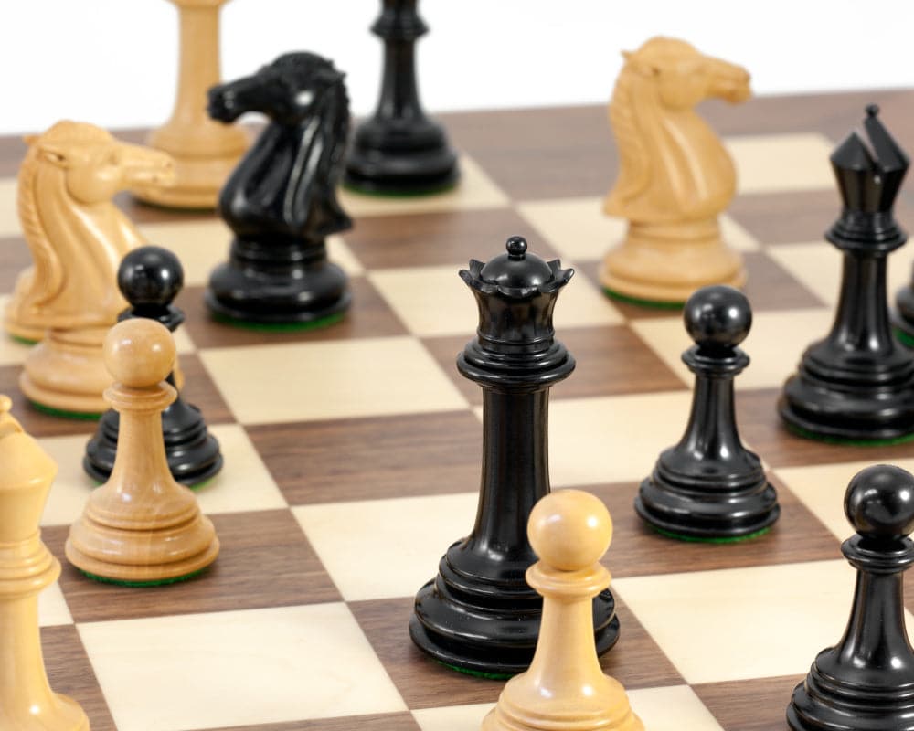 Close-up of Parthenon Grand Ebony and Walnut Chess Set with ebony and boxwood chess pieces on a luxury Spanish chessboard