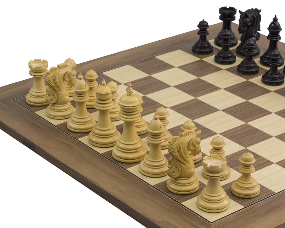 The Kingsgate Ebony and Walnut Chess Set with ornate chessmen on a deluxe walnut and maple board.