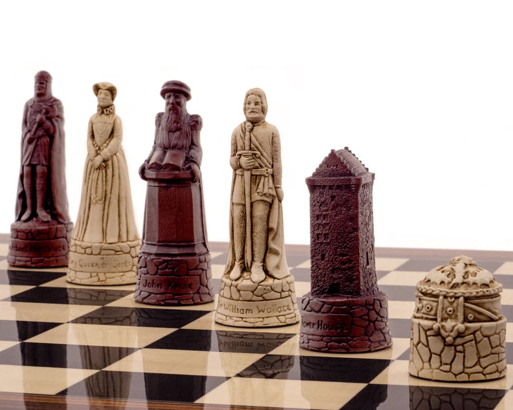 Historic Scottish-themed russet and cream chess pieces on a black anegre and palisander chess board