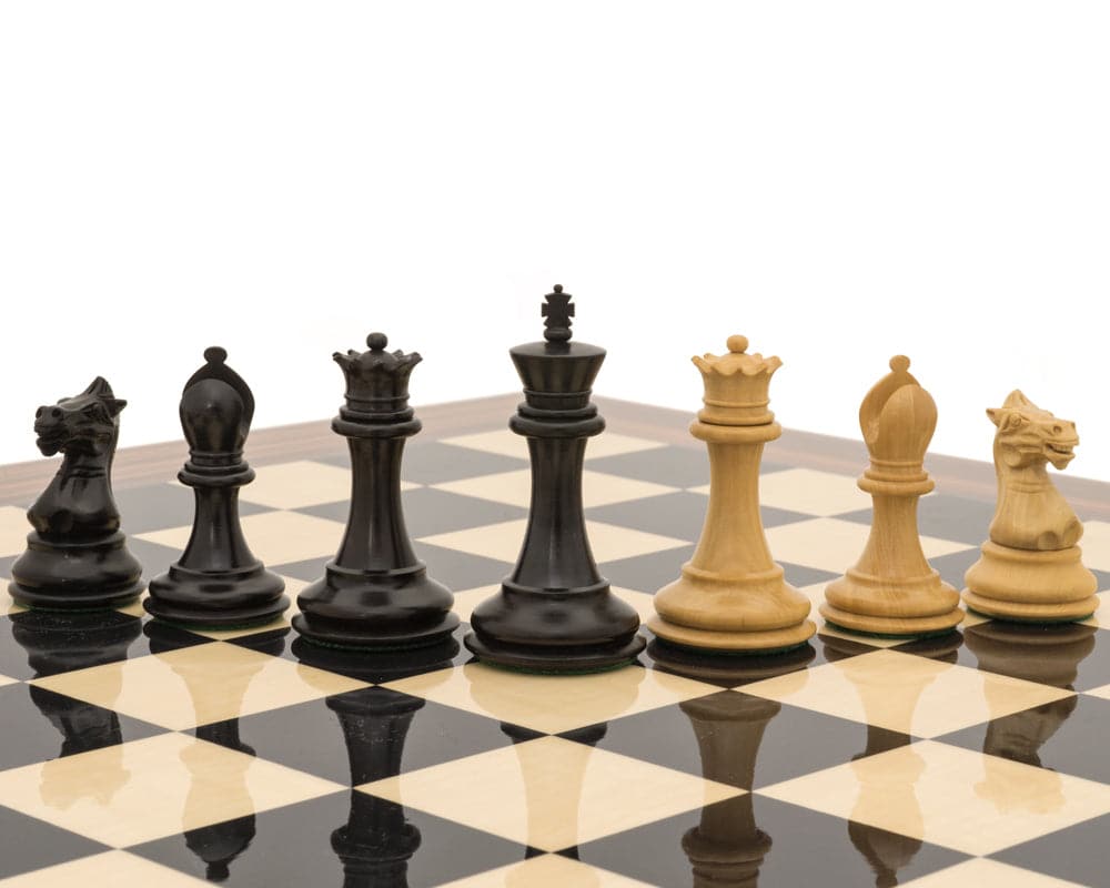 Black and natural Staunton chess men on a black anegre and palisander chessboard, featuring the detailed Sovereign Palisander Staunton Chess Set