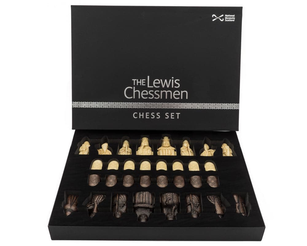 The Isle of Lewis Montgoy Palisander Grand Chess Set with chess pieces displayed in the box.