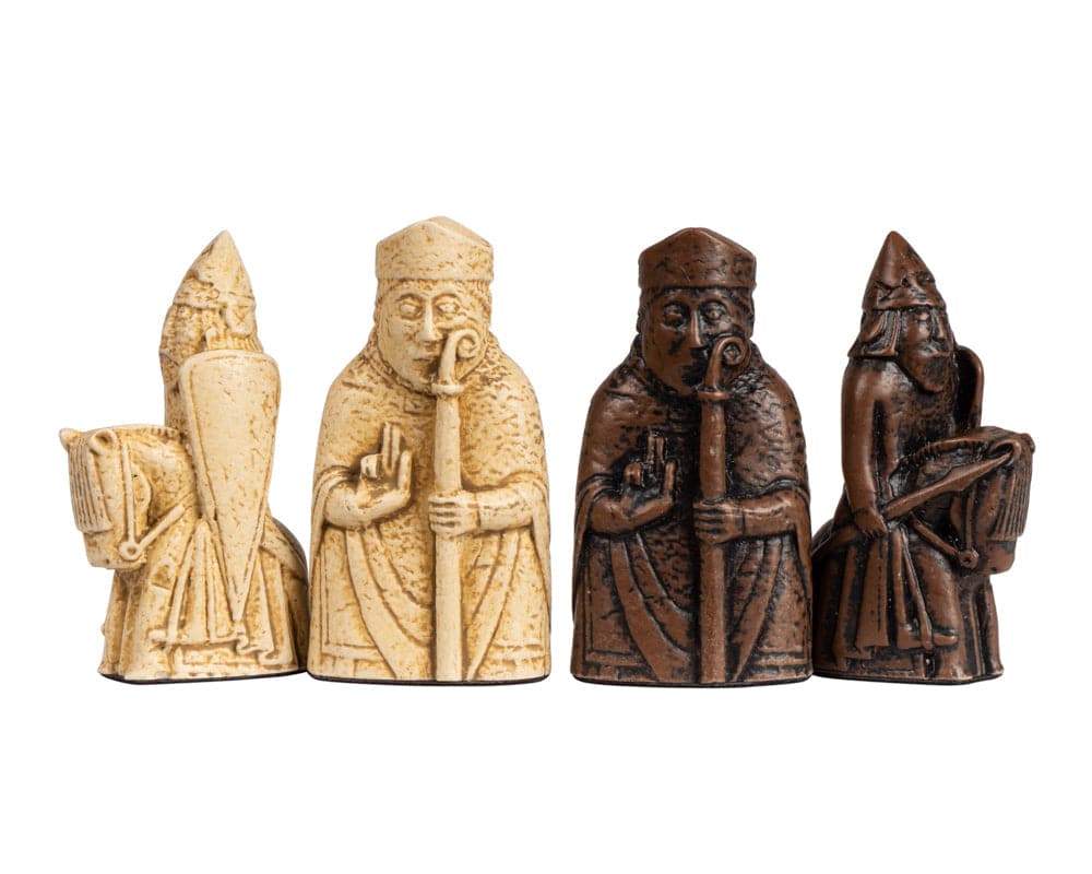 Four Isle of Lewis chess pieces in white and brown from the Walnut Deluxe Chess Set