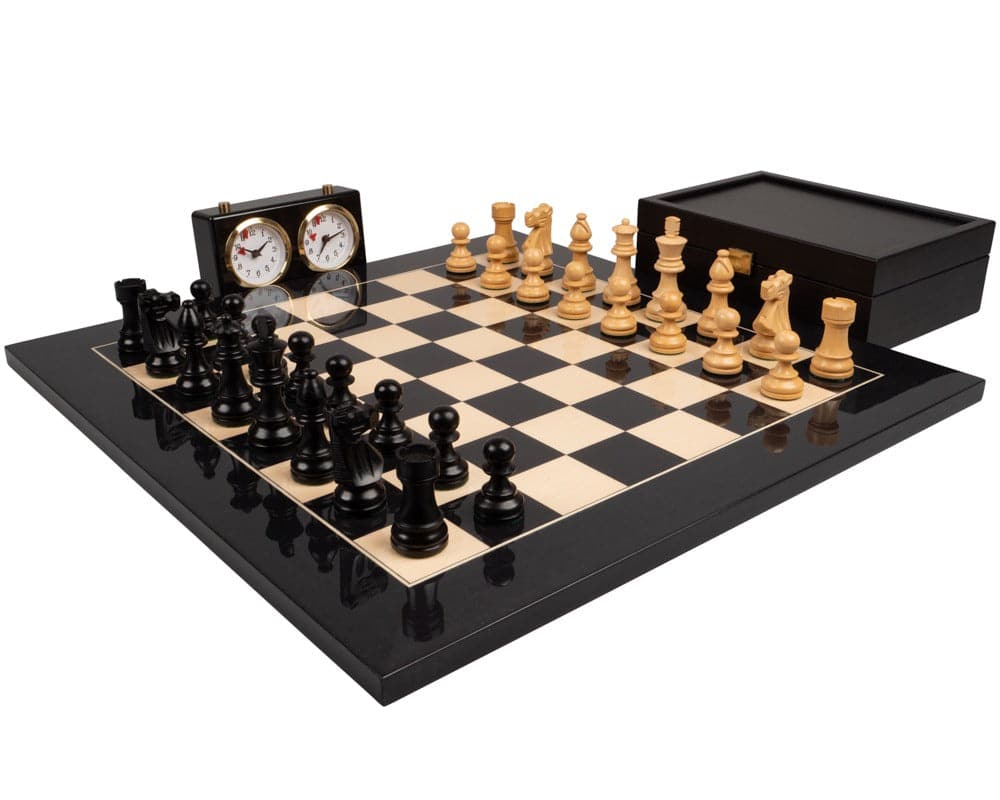 The French Knight Luxury Black Chess Set with elegant black and natural pieces, complete with chess clock on a polished board.