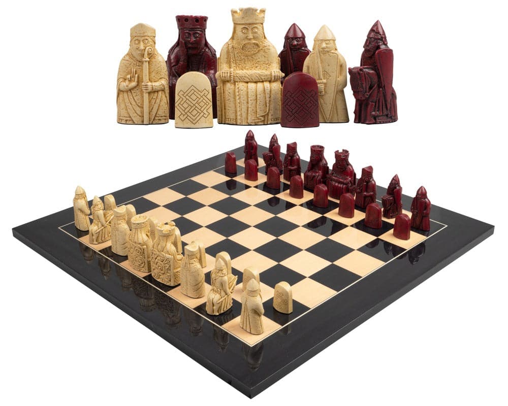 The Isle of Lewis black and red chess set with intricately designed pieces on a chessboard.