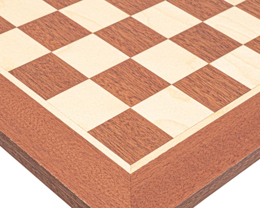 Close-up of a handcrafted mahogany and ivory-colored chessboard with detailed squares and artisanal woodwork.