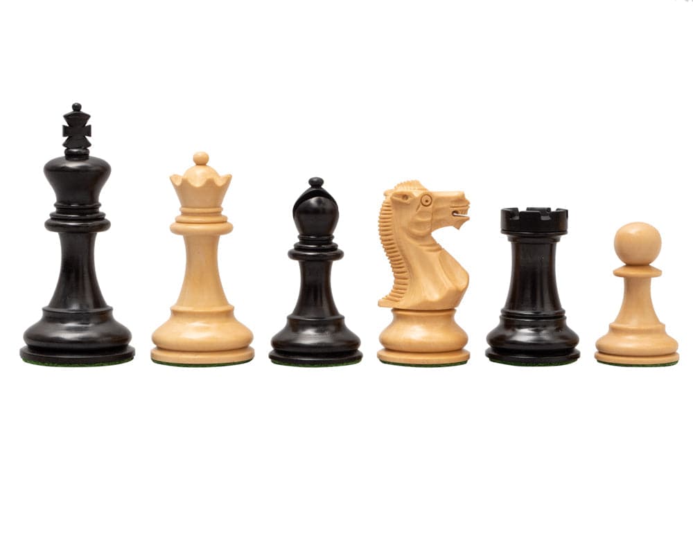 The Highgrove Ebony and Briarwood Luxury Chess Set pieces in black and natural wood, including king, queen, bishop, knight, rook, and pawn.