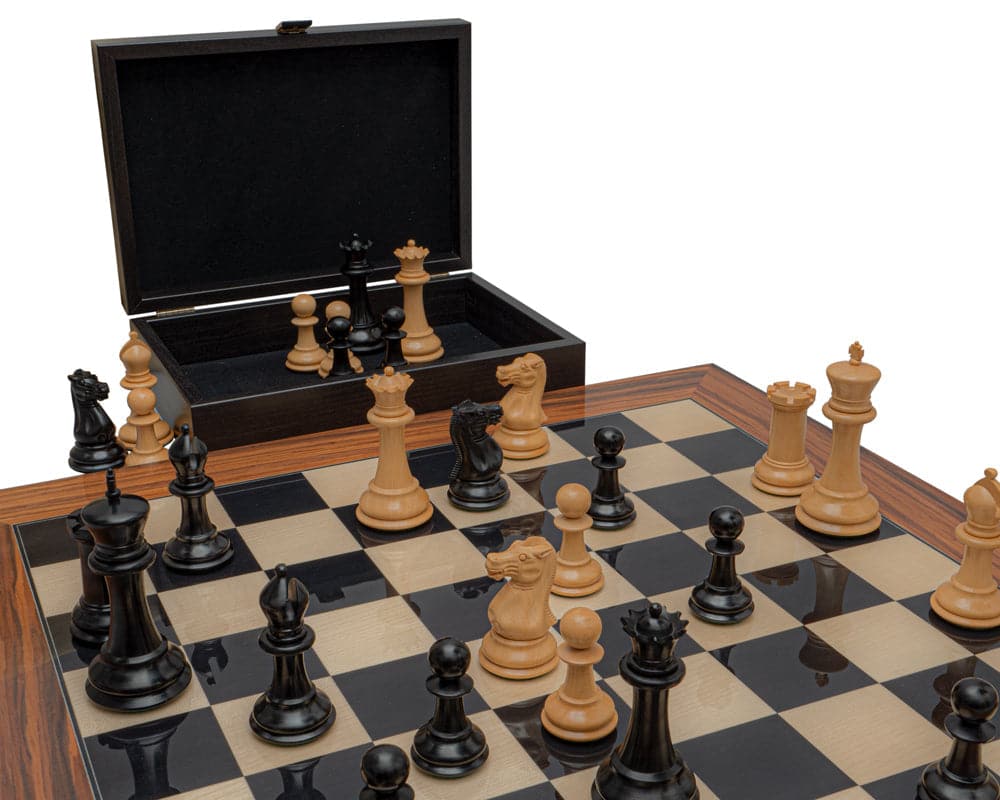 The 1849 Reproduction Staunton Ebony and Palisander Luxury Chess Set on board with boxwood and ebonised pieces in game position.