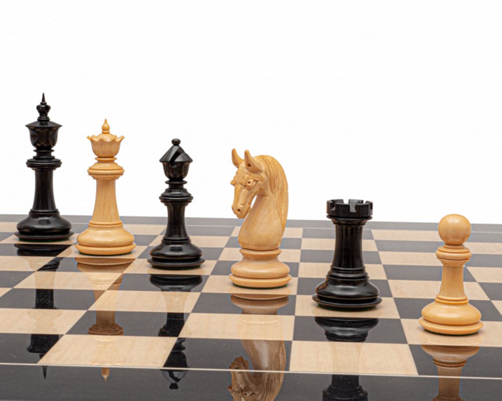 The Blackburne Ebony and Black Anegre Chess Set with handcrafted pieces on a 23.6-inch luxury board, highlighting the 4.5-inch King.