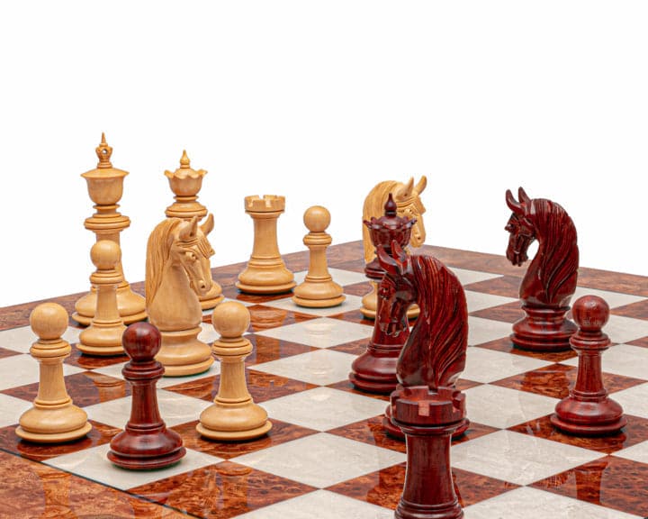 The Blackburne Padauk and Briarwood Luxury Chess Set showcasing handcrafted pieces on a beautifully crafted Italian high gloss board.