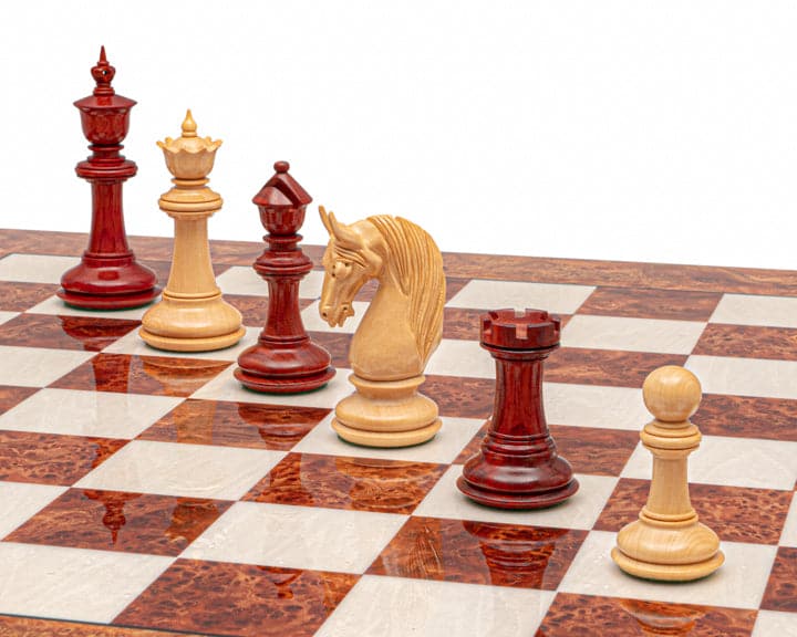 The Blackburne Padauk and Briarwood Luxury Chess Set with handcrafted pieces on high-gloss Italian board with 2.36-inch squares.