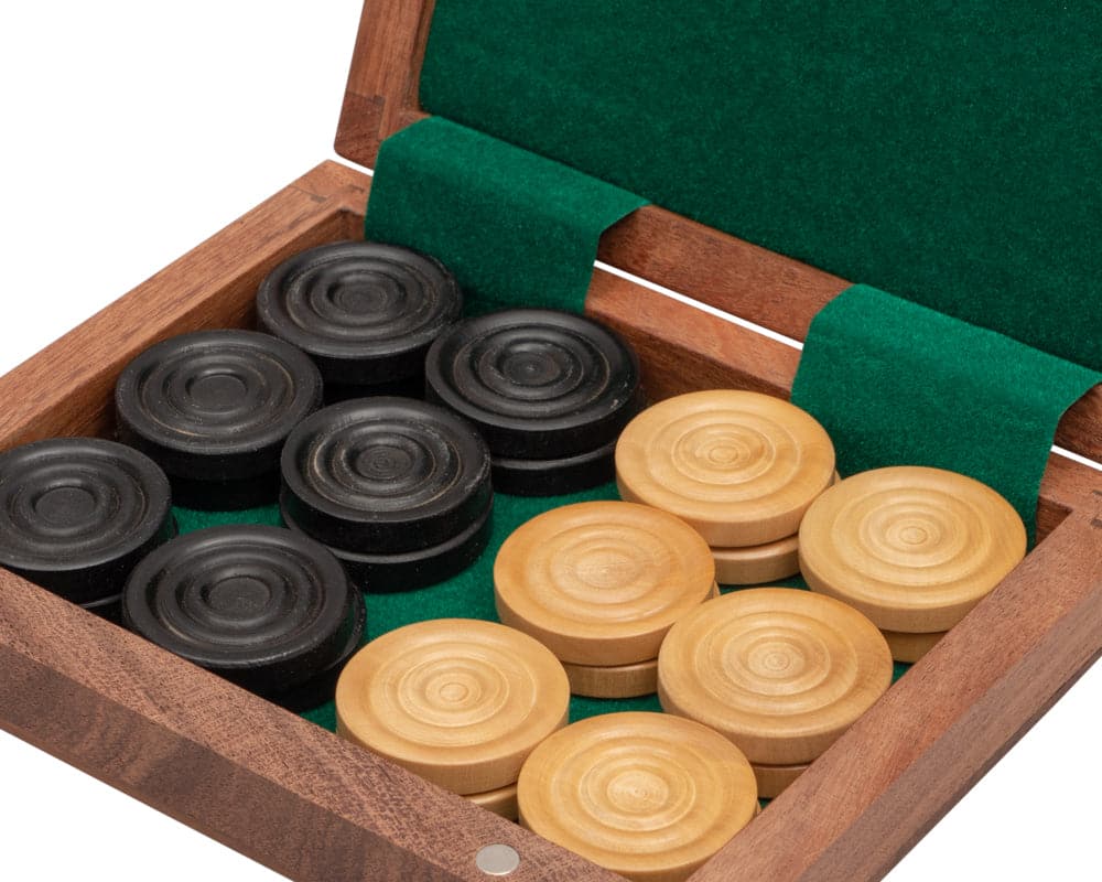 Draught counters made from boxwood in a solid sheesham box with natural wax finish, part of the Traditional Chess and Draughts Set.