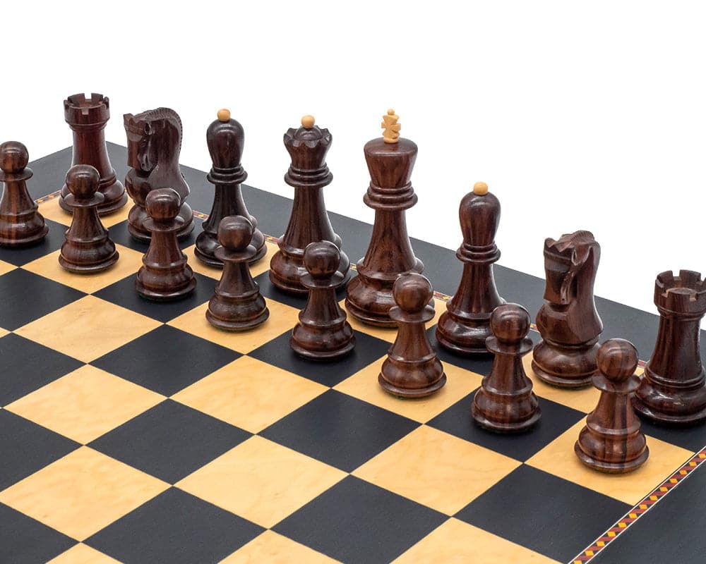 The Queens Gambit Chess Set with dark decorative border and quality wooden pieces on a Rechapados Ferrer board